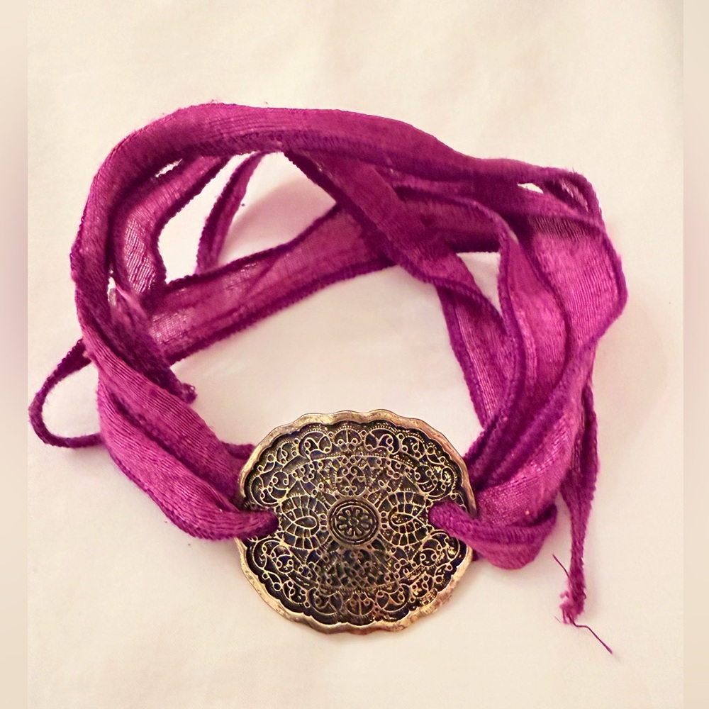 Purple Fabric Bracelet with Intricate Gold Medallion